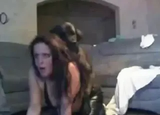 Zoophile in leather pants fucks her pet dog